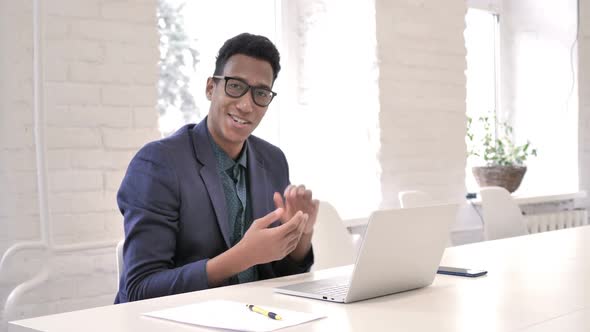 African Man Clapping for His Team at Work Applauding