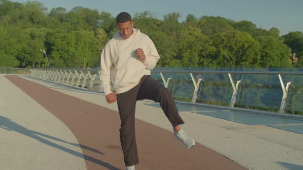 Motivated Athletic African American Male Runner Practicing Morning Jog at Dawn