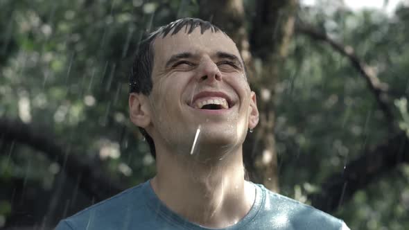 Happy Young Man Under Rain