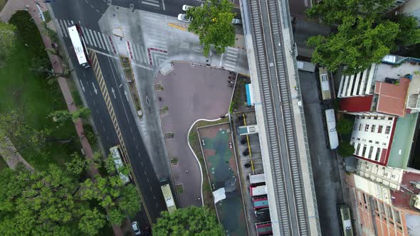 Top down orbital lowering on train rails near Belgrano neighborhood busy streets with traffic, Bueno