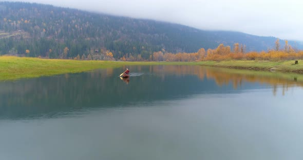 Man Rowing a Boat on A Lake 4k