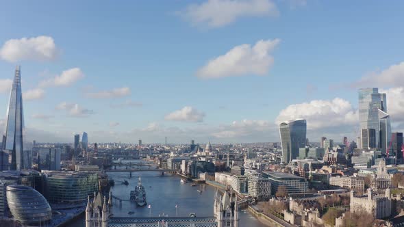 Descending aerial drone shot of central London to tower bridge river thames