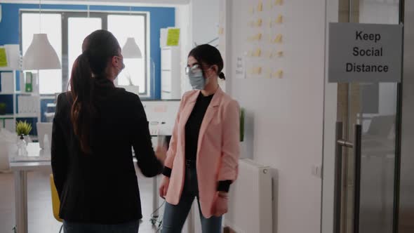 Businesswoman Wearing Face Mask Checking Workers Temperature