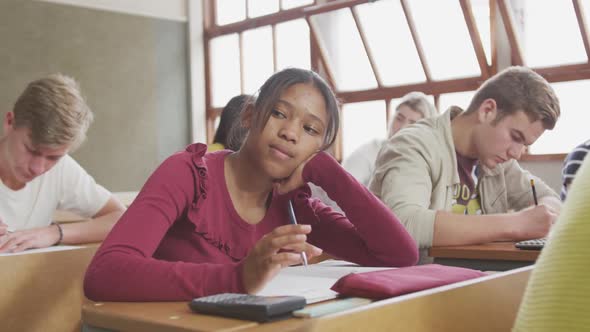 African american girl thoughtful in high school class