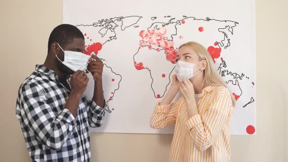 Young Multi-racial Family Learns To Use Medical Masks During the Coronavirus Epidemic. Young Family