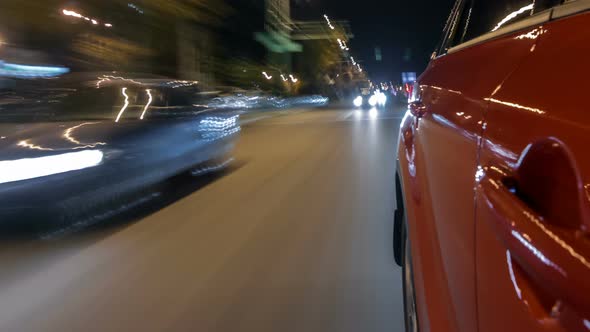 Drivelapse From Side of Car Moving on a Night Avenue in City Timelapse Hyperlapse