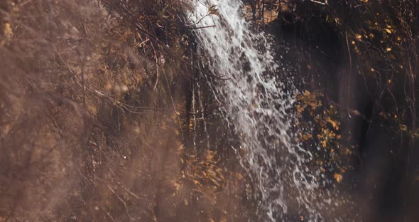 Autumn waterfall at sunset