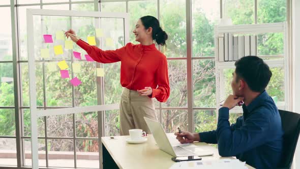 Business People Work on Project Planning Board