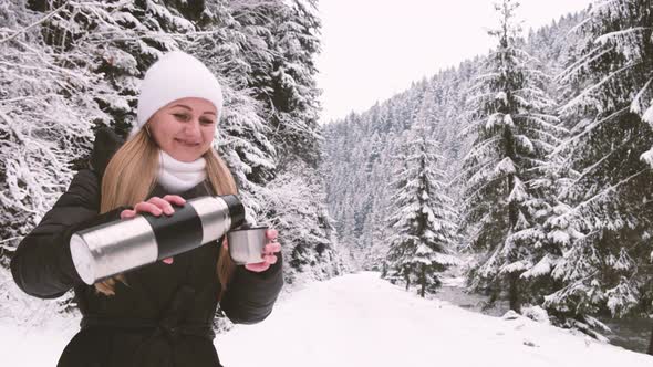 Girl Drinking Tea in the Winter Forest an Amazing Place with a Beautiful Snowcovered Forest