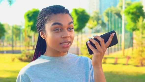 Closeup African American Woman Send Voice Message Outside Lifestyle