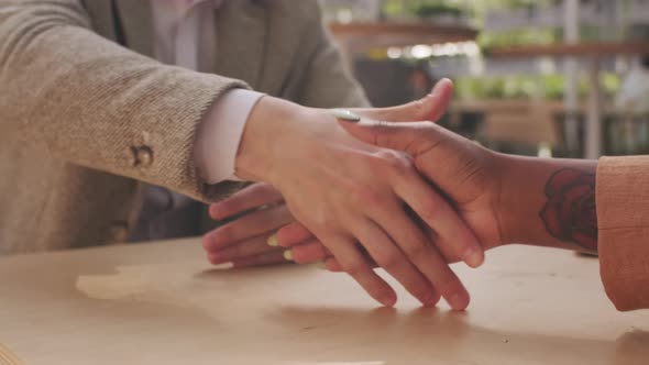  Unrecognizable Businesspeople Shaking Hands