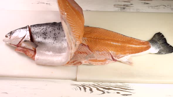 Male Hands with Raw Fish.