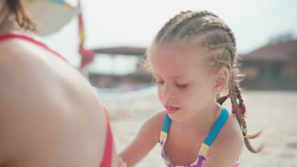 Little Girl Apply Sunscreen for Mother Summer Sea Beach Family on Vacation Child Protect Mom From