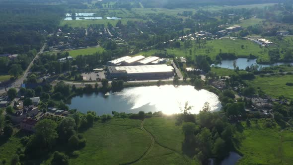 Aerial view of warehouse with trucks.