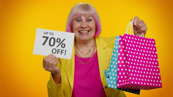 Senior Granny Woman Showing Shopping Bags and Up To 70 Percent Off Inscriptions Banner Black Friday