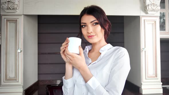 Medium Shot Happy Tenderness Girl Enjoying Break Holding Mug with Hot Beverage