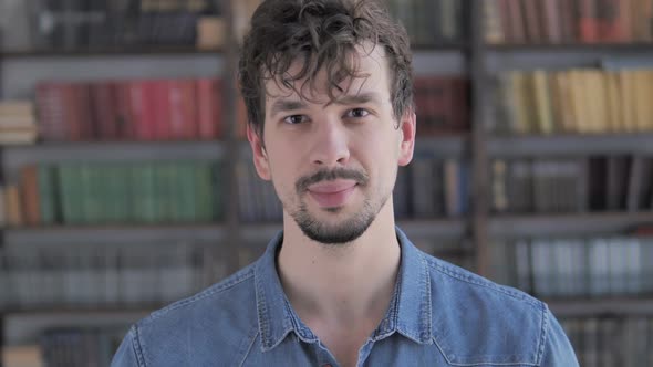 Portrait of Smiling Casual Young Man Looking at Camera