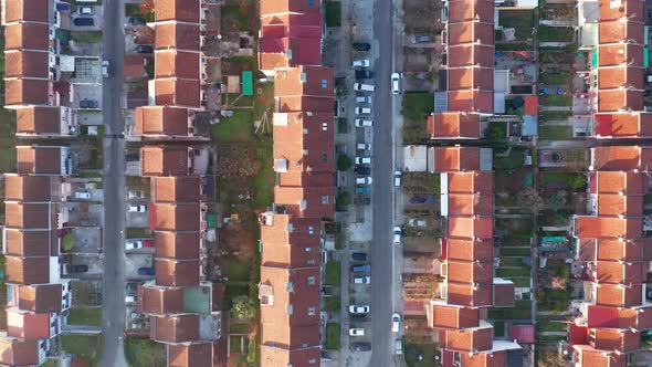 Rows of terrace houses in a mill town. Townhouses with red roofs in a company village or monotown