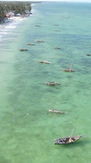 Vertical Video Boats in the Ocean Near the Coast of Zanzibar Tanzania