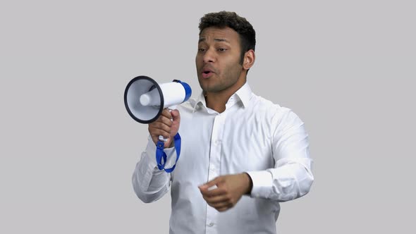 Young Darkskinned Hindu Man Giving Inspiring Speech in Megaphone