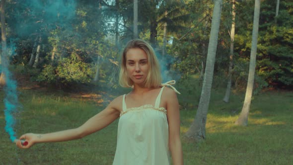 Young Blonde Standing Contemplating Tropical Rainforest Sunset Light Coming From Above