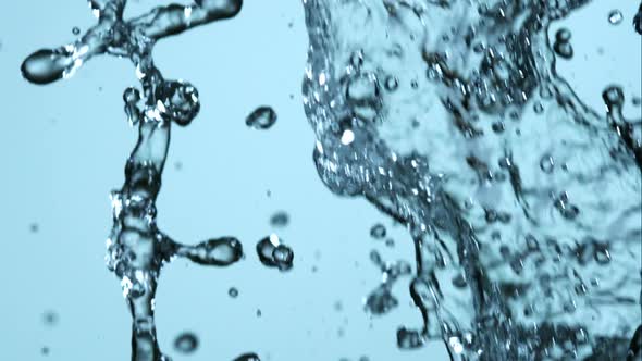 Water pouring and splashing in ultra slow motion 1500fps on a reflective surface - WATER POURS 