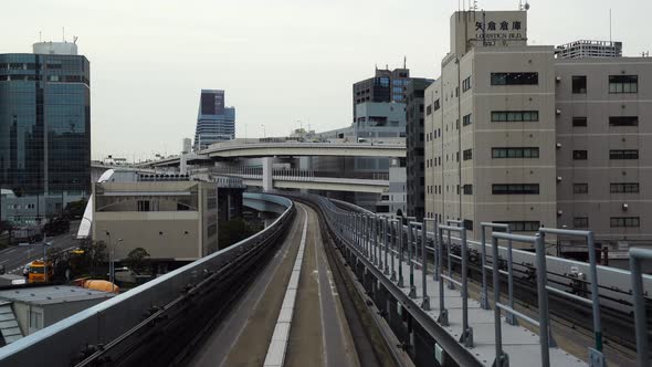 Scenery of a train traveling on the rail of Yurikamome Line in Tokyo