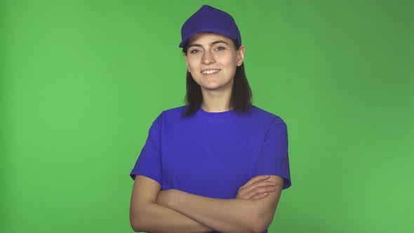 Cheerful Young Female Delivery Worker Smiling To the Camera