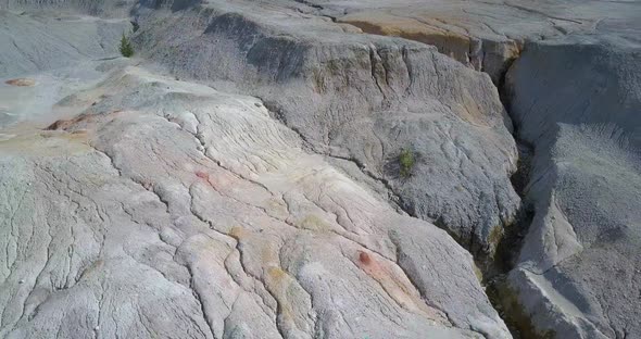 Close Back Motion Over Rock Conglomeration in Old Quarry