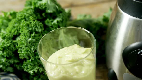 Leafy vegetable with juice in glass 4k