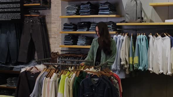 The Girl Makes a Photo of a Bright Blouse