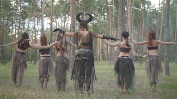 Group of Women Dancers with Make-up and in Mystical Fabulous Costumes Dancing Groovy Dance in the