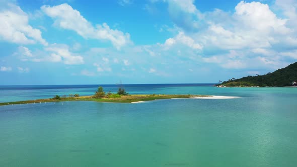 small sandbank with exotic vegetation near the coast of the tropical island. Thailand