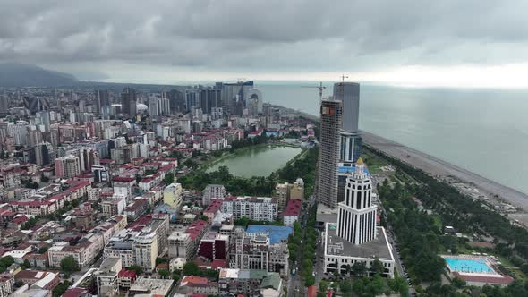 Aerial view of beautiful lake in the center of Batumi. flying over 6 May park. Georgia 2022 summer