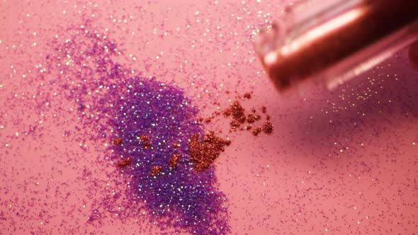 Pouring Glitter on a Pink Background