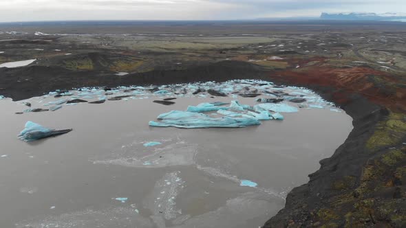 Aerial View of Icebergs Melting in Glacial Lake Water in Highlands of Iceland.  Climate Change and G