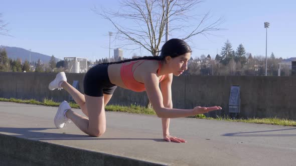 Woman doing yoga table top pose routine with one arm and leg extending