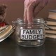 Closeup of Man Taking Family Savings From Glass - VideoHive Item for Sale