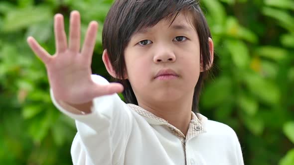 Asian Child Show Stop Hands Gesture For Stop