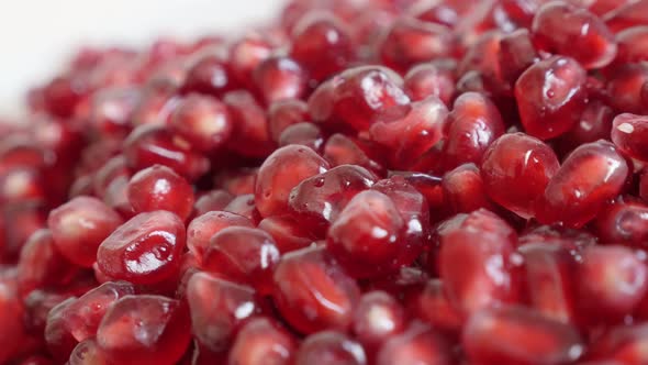 Panning on juicy  Lythraceae family pomegranate  close-up 4K 3840X2160 UHD video - Many red healthy 