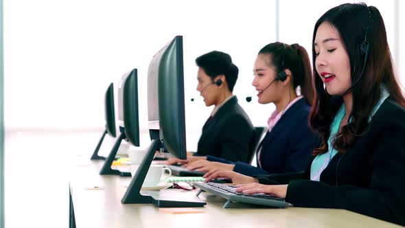 Business People Wearing Headset Working in Office