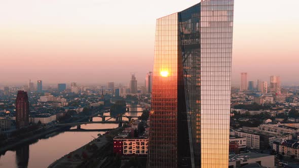 Frankfurt ECB Skyline Aerial Shot at early sunrise reflecting sun