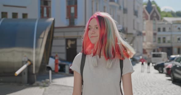 Beautiful Happy Teenage Student Walking and Smiling Along the Street of Sunny Summer City