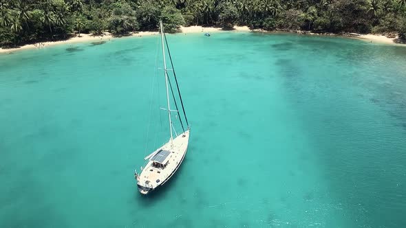 Drone footage of a sail boat at one of Panama's islands "Playa Blanca" located at Colon province.