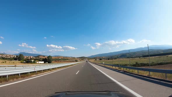 Road Trip on Europe Firstperson View of a Moving Car on a Highway Summer Mountains Natural Landscape