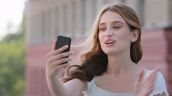 Attractive Blonde Blueeyed Millennial Lady in Summer Dress Record Videoblog