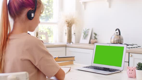 Teenage Girl Studying Online From Home with Distance Teacher