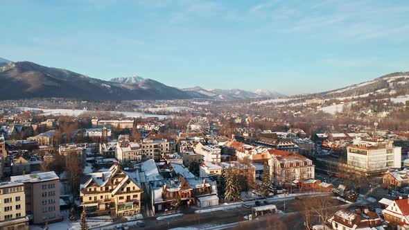 Scenic View Of The City And Mountains In Tygodnik Podhalanski In Poland Europe - aerial shot