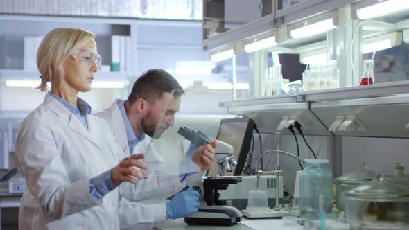 Scientists Using Augmented Reality Screen in Lab alt