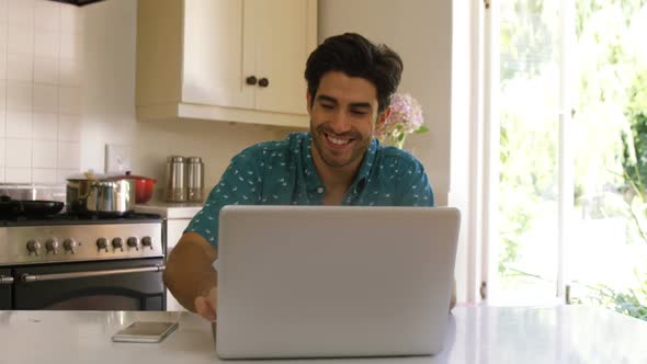 Couple interacting with each other while using digital tablet